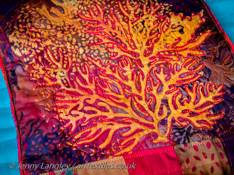 Flap with crinkly fabric covering a coral reef.