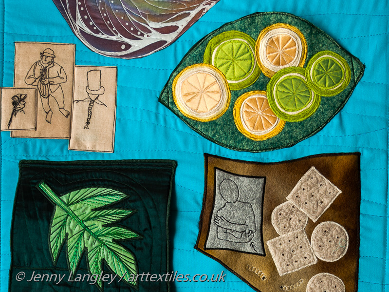 Ordinary 18th Century sailors.  Pocket with slices of lemons and limes, lined with waterproof fabric for holding fabric impregnated with essential oils.  Flap with breadfruit tree leaf, covering a breadfruit.  Patch with hardtack biscuits.