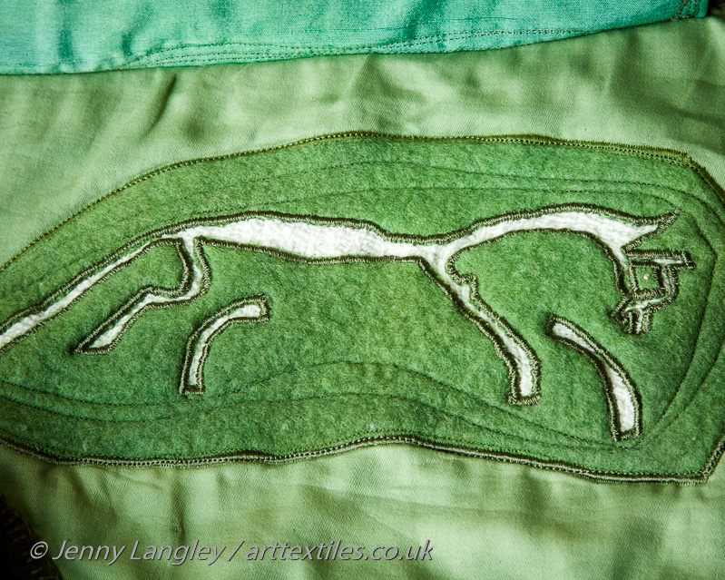 The Bronze Age Uffington White Horse formed by cutting trenches into the grass to reveal the chalk below.