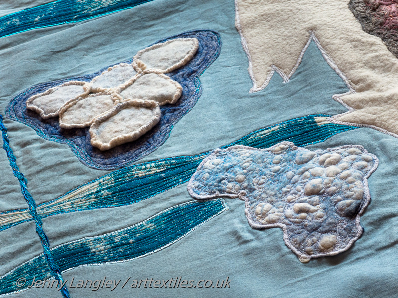 Pancake ice in two magnifications.