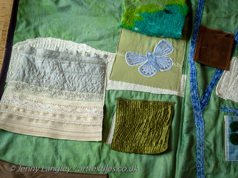 Panel and pocket showing chalk formation.  Chalkhill Blue butterfly which only lives on the chalk Downs.