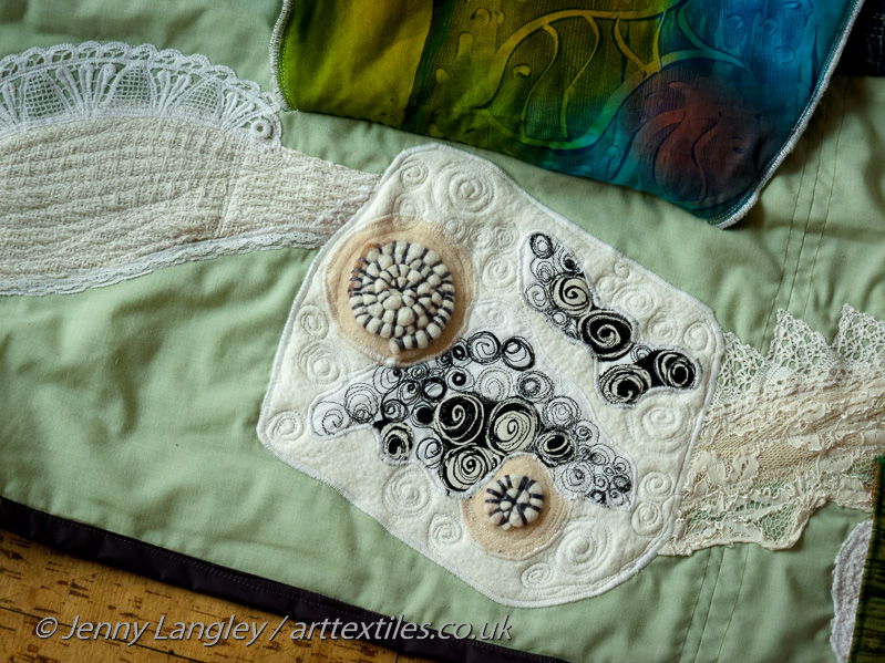 Beneath the lace flap are fossil ammonites. commomly found in the chalk.